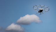 (Files) A Volocopter Volocity air taxi is seen during a demonstration flight at the Saint-Cyr-l'Ecole airfield in Saint-Cyr-l'Ecole, France, on August 8, 2024. (Photo by Thibaud Moritz / AFP)