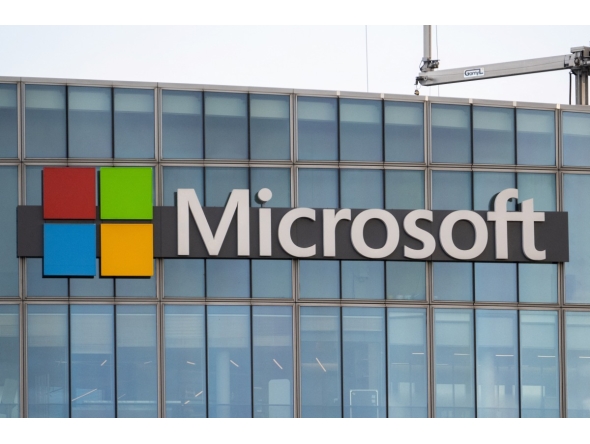 This photograph shows a view of Microsoft's logo on the company's French headquarters in Issy-les-Moulineaux on the outskirts of Paris on January 6, 2025. (Photo by Martin LELIEVRE / AFP)