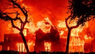 A home is engulfed in flames during the Eaton fire in the Altadena area of Los Angeles County, California on January 8, 2025. (Photo by Josh Edelson / AFP)


