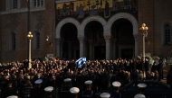 Pallbearers carry the coffin of former Greek Prime Minister Costas Simitis after a mass for his funeral, outside the Metropolitan Cathedral of Athens on January 9, 2025. (Photo by Aris MESSINIS / AFP)
