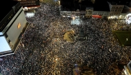 An aerial photograph shows demonstrators gathering during a protest over the fatal roof collapse of the Novi Sad train station on January 26, 2025. (Photo by Sasa Djordjevic / AFP)
 