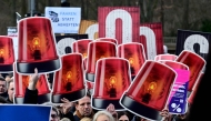 Demonstrators take part in a rally during a nationwide so-called Economic Warning Day (Wirtschaftswarntag) on January 29, 2025 in Berlin, as more than 140 associations and over 200 companies from all over Germany are jointly calling on politicians to take measures in order to ensure the country's economic stability. (Photo by Tobias SCHWARZ / AFP)
