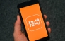  This photo illustration shows the logo of fast fashion e-commerce company Temu displayed on a mobile phone in Brussels, on November 4, 2024. Photo by Nicolas TUCAT / AFP