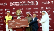 Commercial Bank Board Member Abdul Rahman bin Hamad Al Attiyah and Commercial Bank Group CEO Joseph Abraham along with QGA President Hamad Abdullah Al Mana present the winner’s cheque to China’s Haotong Li at the Doha Golf Club yesterday.