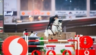 Italy's Emanuele Gaudiano astride grey gelding Chalou's Love PS clears a rail.