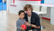 Andrey Rublev with a young fan at the ExxonMobil Qatar Public Village.