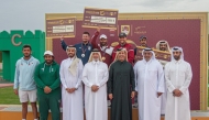 QOC First Vice President Mohammed bin Yousef Al Mana along with other officials and podium winners of men's skeet event. 
