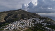 An aerial view shows the main town of Amorgos, on the Greek island of Amorgos, in the Aegean Sea, on February 15, 2025. (Photo by Angelos Tzortzinis / AFP)
