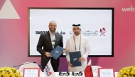 Director of the GCO and Chairman of the Permanent Web Summit Organising Committee H E Sheikh Jassim bin Mansour bin Jabor Al Thani and Vice President and General Manager of Snap Inc MENA Hussein Freijehl during the signing of the MoU. 
