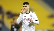 Al Sadd's Rafa Mujica celebrates after scoring a goal.