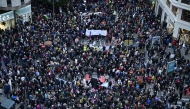 People gather during a demonstration to protest the regional government's response and call for the resignation of Valencia regional president Carlos Mazon, four months after devastating floods in Valencia, eastern Spain, on March 01, 2025. (Photo by JOSE JORDAN / AFP)
