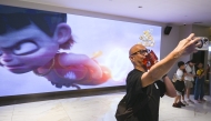A man poses for a selfie during the premiere of the Chinese animated film 