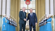This handout photograph taken and released by Turkish Presidency Press Office on March 12, 2025, shows Turkey's President Recep Tayyip Erdogan (left) welcoming Poland's Prime Minister Donald Tusk prior to their meeting at the Presidential Complex in Ankara. (Photo by HANDOUT / Turkish Presidency Press Office / AFP)
