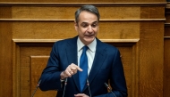 Greek Prime Minister Kyriakos Mitsotakis addresses the audience at the Greek Parliament in Athens, on March 5, 2025. Photo by Angelos TZORTZINIS / AFP