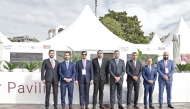 Invest Qatar and Aqarat officials pose for a group photo during the MIPIM 2025.