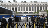 Security officials stand guard in front of the Constitutional Court in Seoul on March 24, 2025, ahead of the impeachment verdict for South Korean Prime Minister Han Duck-soo. (Photo by Jung Yeon-je / AFP)