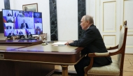 In this pool photograph distributed by the Russian state agency Sputnik, Russia's President Vladimir Putin chairs a Security Council meeting via videoconference at the Kremlin in Moscow on March 28, 2025. (Photo by Vyacheslav Prokofyev / POOL / AFP)
