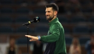 Novak Djokovic of Serbia speaks after losing to Jakub Mensik of the Czech Republic during the men's singles final on the final day of the Miami Open Presented by Itau 2025 at Hard Rock Stadium on March 30, 2025 in Miami Gardens, Florida. Matthew Stockman/Getty Images/AFP