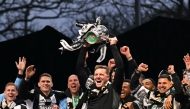 Newcastle United's English head coach Eddie Howe celebrates with the League Cup trophy on stage at the Town Moor in Newcastle upon Tyne, in north-east England, on March 29, 2025. (Photo by Oli SCARFF / AFP)
