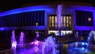The headquarters of the Ministry of Municipality illuminates in blue at Corniche.