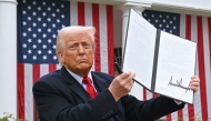 US President Donald Trump holds a signed executive order after delivering remarks on reciprocal tariffs during an event in the Rose Garden entitled 