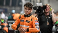 McLaren's British driver Lando Norris looks on after getting pole position in the qualifying session ahead of the Formula One Singapore Grand Prix night race at the Marina Bay Street Circuit in Singapore on September 21, 2024. Photo by Lillian SUWANRUMPHA / AFP.


