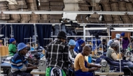 Workers use sewing machines at the Afri-Expo Textile Factory in Maseru, Lesotho on March 19, 2025. (Photo by Roberta Ciuccio / AFP)
