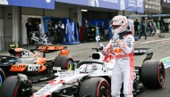 Red Bull Racing's Dutch driver Max Verstappen celebrates taking pole position in the qualifying session of the Formula One Japanese Grand Prix at the Suzuka circuit in Suzuka, Mie prefecture on April 5, 2025. (Photo by MOHD RASFAN / AFP)

