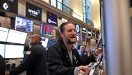 Traders work at the American Stock Exchange (AMEX) on the floor of the New York Stock Exchange (NYSE) at the closing bell in New York City, on April 4, 2025. (Photo by Timothy A. Clary / AFP)