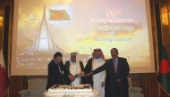 Minister of Awqaf and Islamic Affairs H E Ghanem bin Shaheen bin Ghanem Al Ghanim, Director of the Protocol Department at the Ministry of Foreign Affairs H E Ibrahim Yousif Abdullah Fakhro, Ambassador of Bangladesh to Qatar H E Mohammed Nazrul Islam and Dean of the Diplomatic Corps H E Ali Ibrahim Ahmed cutting a cake to mark 55th Independence and National Day of Bangladesh.