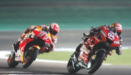 Mission Winnow Ducati’s Italian rider Andrea Dovizioso (right) and Repsol Honda’s Spanish rider Marc Marquez compete during the MotoGP Qatar Grand Prix in this March 10, 2019 file photo. AFP