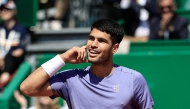 Spain's Carlos Alcaraz reacts after a point as he plays against Germany's Daniel Altmaier during the Monte Carlo ATP Masters Series Tournament round of 16 tennis match on the Ranier III court at the Monte Carlo Country Club in Roquebrune-Cap-Martin on April 10, 2025. (Photo by Valery HACHE / AFP)