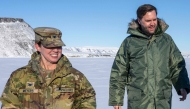 US Vice President JD Vance walks with Col. Susan Meyers (L), commander of the US military's Pituffik Space Base, as they tour the base in Greenland on March 28, 2025. (Photo by Jim WATSON / POOL / AFP)
