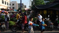 Children play with water guns during Myanmar's New Year water festival, locally known as Thingyan, by a street market in Mandalay on April 13, 2025. (Photo by Sai Aung MAIN / AFP)