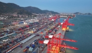 Containers and cranes are seen at the container port in Lianyungang, in China's eastern Jiangsu province on April 13, 2025. (Photo by AFP) 
 