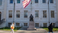 People walk through Harvard Yard at Harvard University in Cambridge, Massachusetts, on December 12, 2023. (Photo by Joseph Prezioso / AFP)
 