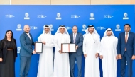 Chief Corporate Development and Business Excellence Officer at QFZ, Dr. Fahad Zainal with other officials receiving the ISO certifications. 