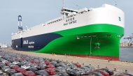 Chinese-made MG cars wait to be loaded onto the newly commissioned and Chinese-built 7,800-car LNG dual-fuel car carrier 