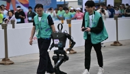 A robot takes part in the humanoid robot half marathon in Beijing on April 19, 2025. (Photo by Pedro Pardo / AFP)
 