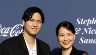 (Files) Shohei Ohtani (L) and Mamiko Tanaka at the Los Angeles Dodgers Foundation's 2024 Blue Diamond Gala at Dodger Stadium on May 2, 2024 in Los Angeles, California. (Photo by Kevin Winter / Getty Images North America / AFP)