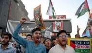 Supporters of Islami Jamiat-e-Talaba (IJT), a student wing of Pakistan's Jamaat-e-Islami (JI) party stage a pro-Palestinian protest outside a Kentucky Fried Chicken (KFC) restaurant on May 7, 2024. (Photo by Farooq Naeem / AFP)
