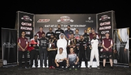Qatar Racing Club Director General Sheikh Jabor bin Khalid Al Thani poses with the podium winners.