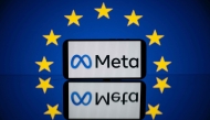 This picture taken on April 27, 2023 in Toulouse, southwestern France, shows a screen displaying the Meta logo and the European flag. Photo by Lionel BONAVENTURE / AFP
