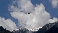 An Indian military helicopter is seen in flight as viewed from Baisaran, a day after tourist attack in Pahalgam, about 90 kms (55 miles) from Srinagar on April 23, 2025. (Photo by TAUSEEF MUSTAFA / AFP)
