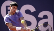 Spain's Carlos Alcaraz returns the ball to France's Arthur Fils during the ATP Barcelona Open 