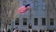 Demonstrators stand around the John Harvard Statue in Harvard Yard following a rally against President Donald Trump痴 attacks on Harvard University at Harvard University in Cambridge, Massachusetts on April 17, 2025. (Photo by Joseph Prezioso / AFP)