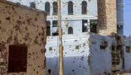 File: A bullet-riddled buildings in Khartoum's twin-city Omdurman on March 20, 2025. (Photo by Ebrahim Hamid / AFP)