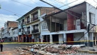 A damaged house is pictured after the earthquake that struck the city of Esmeraldas, Ecuador on April 25, 2025. Photo by Antony QUINTERO / AFP