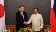 Japan's Prime Minister Shigeru Ishiba (left) and Philippine President Ferdinand Marcos before the start of a bilateral meeting at the Malacanang Palace in Manila on April 29, 2025. (Photo by Rolex Dela Pena / POOL / AFP)