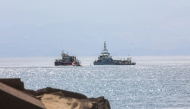 A Coast Guard boat and an Italian fireboat search for six others missing after recovering a victim due to a sailboat sank off the coast of Porticello, nosthwestern of Sicily Island, on August 19, 2024. Photo by Igor Petyx / ANSA / AFP.

